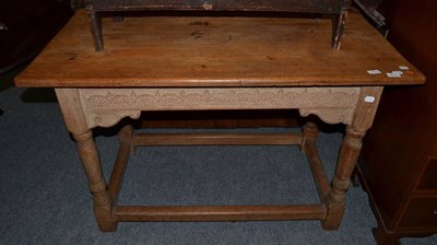 Lot 1610 - ^ An 18th century joined oak side table, the rectangular top above a lunette carved frieze...