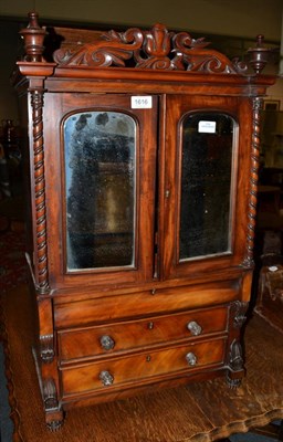 Lot 1616 - A miniature Victorian mahogany clothes press, circa 1850, with mirrored doors enclosing sliding...