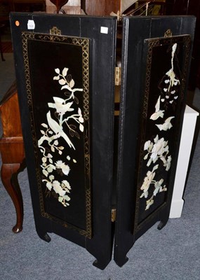 Lot 1626 - ^ A Japanese black lacquered screen with hardstone panels, 121cm high