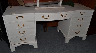 Lot 1627 - A painted nine drawer desk/dressing table, 161cm wide