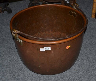 Lot 1636 - ^ A 19th century copper cauldron with iron swing handle,  51cm diameter