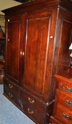 Lot 1639 - ^ An 18th century panelled oak gentleman's wardrobe, 141cm wide