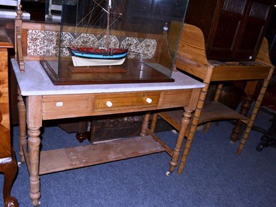 Lot 1643 - A Regency pine washstand, early 19th century, with a three quarter gallery back above three...