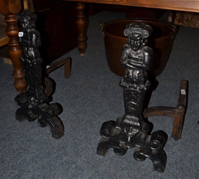 Lot 1647 - {} A pair of George III cast iron andirons modelled as caryatid figures, 60cm high