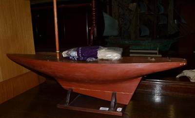 Lot 1649 - A pond yacht hull unpainted with single mast (missing rudder) (original sails and rigging in...