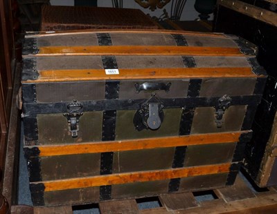 Lot 1651 - A dome top travelling trunk with leather carrying handles, 76cm wide