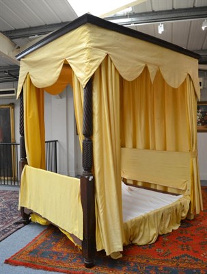 Lot 1659 - ^ A George III mahogany four poster bed with canopy top and spiral turned posts, 257cm high