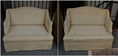 Lot 1661 - A pair of wing backed sofas of small proportions, from the first half of the 20th century,...