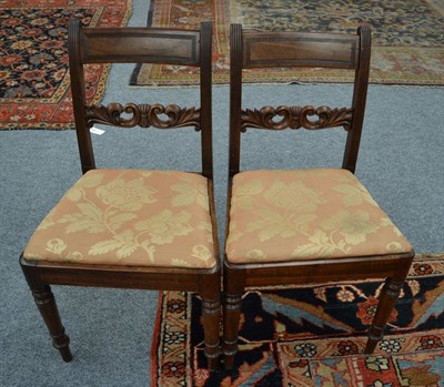 Lot 1665 - A set of six mahogany dining chairs, circa 1820, the reeded uprights with C scroll back...