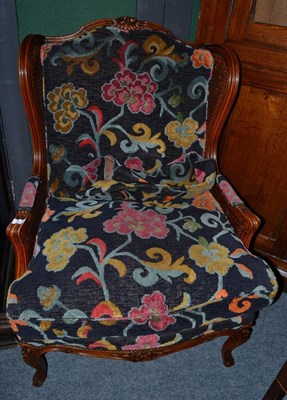 Lot 1668 - A late 19th/early 20th century double caned bergere armchair, later recovered with squab...