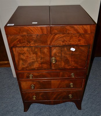 Lot 1673 - # A George III mahogany washstand with hinged lid revealing apertures for a washbasin and a...