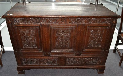 Lot 1677 - ^ An 18th century panelled oak kist fitted with two drawers, 131cm wide