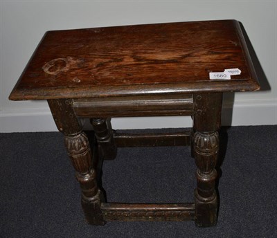 Lot 1680 - An Elizabethan style oak joint stool, 49cm wide