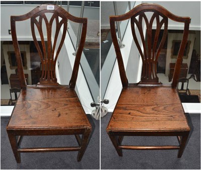 Lot 1684 - A set of four elm chairs with solid seats, 48cm wide