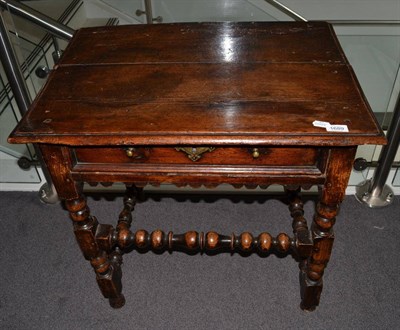 Lot 1689 - {} A 17th century pine bobbin turned side table fitted with single drawer, 70cm wide