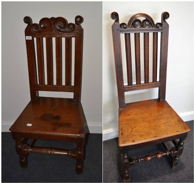 Lot 1692 - {} A pair of early 18th century joined oak chairs, bordered seats and turned stretchers, 45cm wide