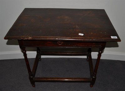 Lot 1694 - {} An early 18th century provincial oak side table, fitted with single frieze drawer, raised on...