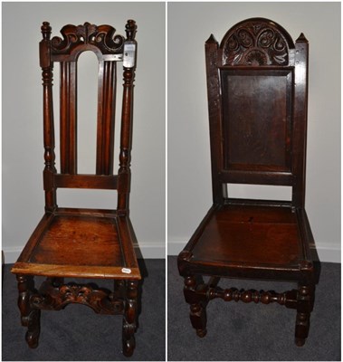 Lot 1695 - {} A late 17th century oak hall chair with carved top wall, 44cm wide, and an early 18th...