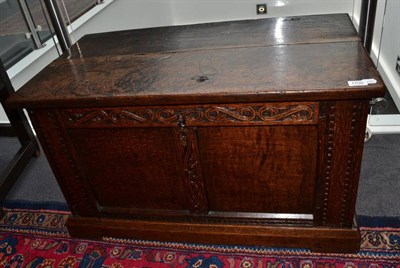 Lot 1700 - An 18th century carved oak chest with hinged lid, 93cm wide