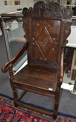 Lot 1701 - {} A 17th century joined oak Wainscot armchair with lozenge carved back support above a boarded...