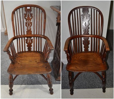 Lot 1702 - A yew and elm high back Windsor armchair, circa 1840, with double spindle back support and...