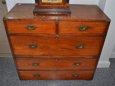 Lot 1715 - A 19th century teak and brass bound straight front campaign chest, in two halves with two short...