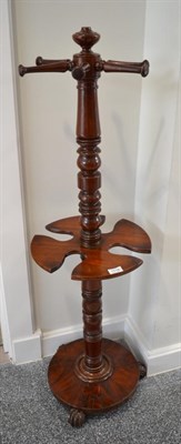 Lot 1718 - A 19th century mahogany whip and boot stand with spindle turned arms on a turned support, 126cm...