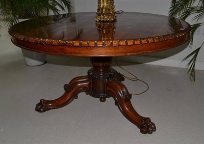 Lot 1723 - An early Victorian rosewood tilt-top circular breakfast or dining table, circa 1840, with gadrooned