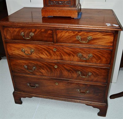 Lot 1730 - A George III mahogany straight fronted chest of drawers, with a moulded top above two short and...