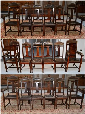 Lot 1734 - A set of six chairs, with shaped top rails over a pierced splat, nailed seats, on tapering...