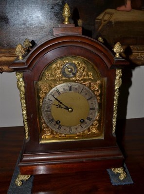 Lot 1735 - A mahogany quarter striking table clock, circa 1910, arched pediment, side sound frets, scroll...