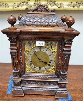 Lot 1736 - A carved oak chiming table clock, circa 1910, side frets, brass dial with a Roman numeral...