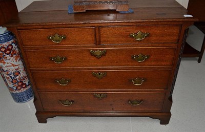 Lot 1737 - A George III oak chest of five drawers between blind fret carved stiles, 97cm wide