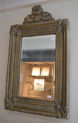 Lot 1738 - A Victorian embossed brass mirror, 113cm high