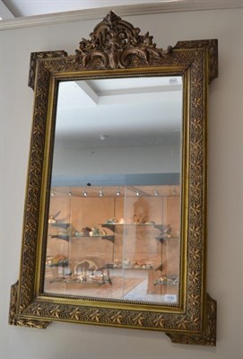 Lot 1742 - A Victorian gilt and gesso wall mirror with decorative plume, 116cm high