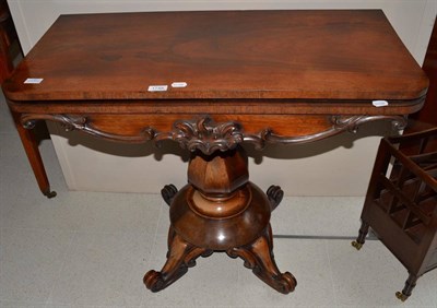 Lot 1748 - A William IV rosewood fold over card table, with a hinged lid enclosing a green lined interior,...