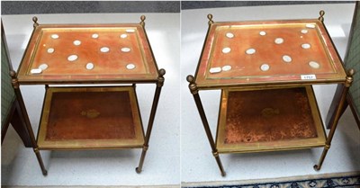 Lot 1757 - A pair of gilt brass two tier side tables, each top inset with plaster cameos beneath a glass...