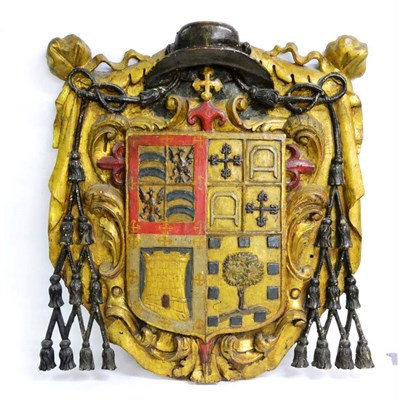 Lot 1758 - A Dutch gilt wood and gesso coat of arms, 18th century, with bishop's hat cresting over the...