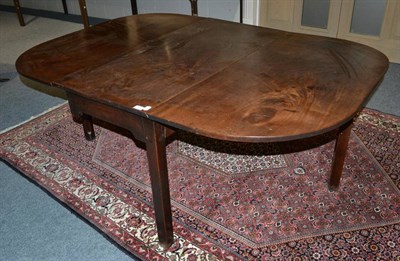 Lot 1759 - An 18th century mahogany drop leaf table, 174cm long extended