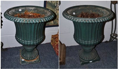 Lot 1762 - A pair of green cast iron campana shaped garden urns, height 62cm