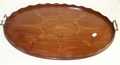 Lot 1769 - An Edwardian mahogany and marquetry tea tray of oval form, inlaid with roses in a square shape...