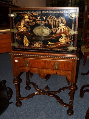 Lot 1776 - A 1920's Japanned cabinet in the 17th century style, with two cupboard doors raised on a walnut...