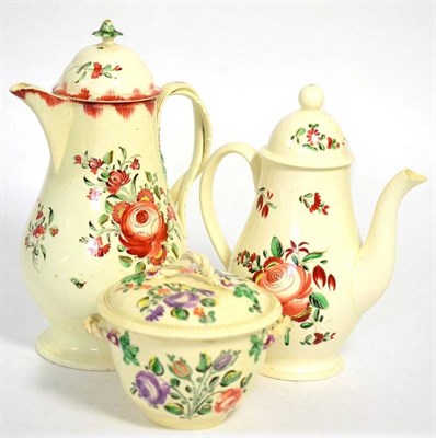 Lot 14 - A Creamware small coffee pot and cover, circa 1770, of baluster form painted in colours with...