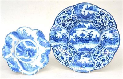 Lot 18 - A Delft lobed dish, circa 1700, painted in blue in Chinese transitional style with figures in...