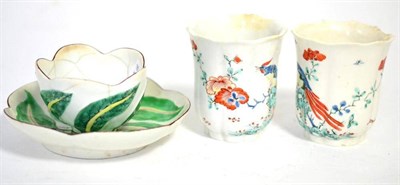 Lot 39 - A pair of Chelsea porcelain fluted beakers, circa 1752, painted in Kakiemon style with a bird...