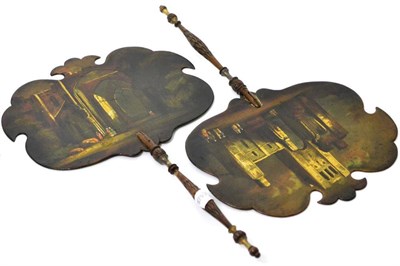 Lot 48 - A pair of Regency lacquered papier-mâché face screens of cartouche form, painted with figures...