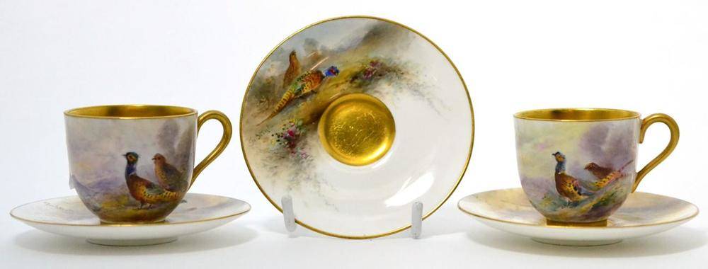 Lot 53 - A pair of Royal Worcester porcelain coffee cups and three saucers painted by James Stinton,...