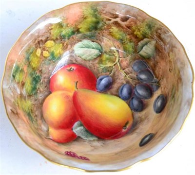 Lot 71 - A Royal Worcester porcelain bowl, 1960, decorated with fruit on a mossy bank, indistinctly...