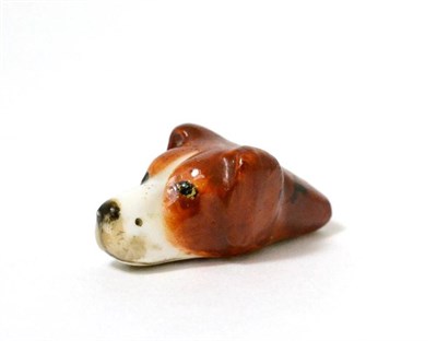 Lot 73 - A Royal Worcester porcelain whistle modelled as a dogs head, printed mark in puce, 4cm long