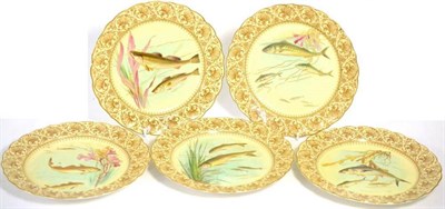 Lot 78 - A set of five Royal Worcester plates, 1899, printed and over painted with fish within in a...